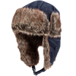 A dark blue fur-lined hat is positioned at an angle with its flaps down showcasing soft brown fur in a contrasting backdrop highlighting its shape and texture.