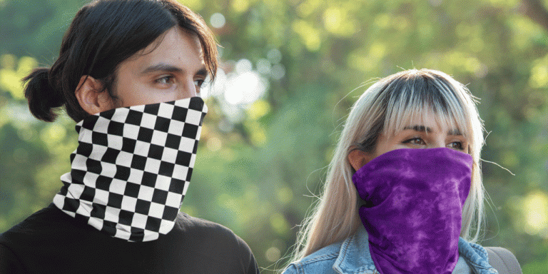 A man and woman wearing a neck gaiter.