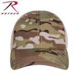 A camouflage-patterned cap rests on a flat surface with a slight curve to the brim showcasing various shades of green brown and white within its design. The logo above reads ROTHCO.