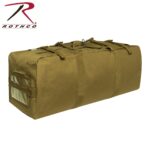 A large olive green duffel bag rests horizontally featuring thick handles and straps with a clear compartment on the side set against a plain white background.