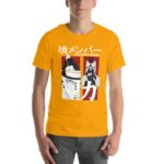 A person wears a bright yellow t-shirt featuring a graphic design of two characters with Japanese text above and below them in a bold style against a contrasting background.