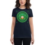 A person wearing a navy t-shirt features a green circular design with text that reads HAPPY ST. PATRICK'S DAY surrounding an illustration of a leprechaun and shamrocks.