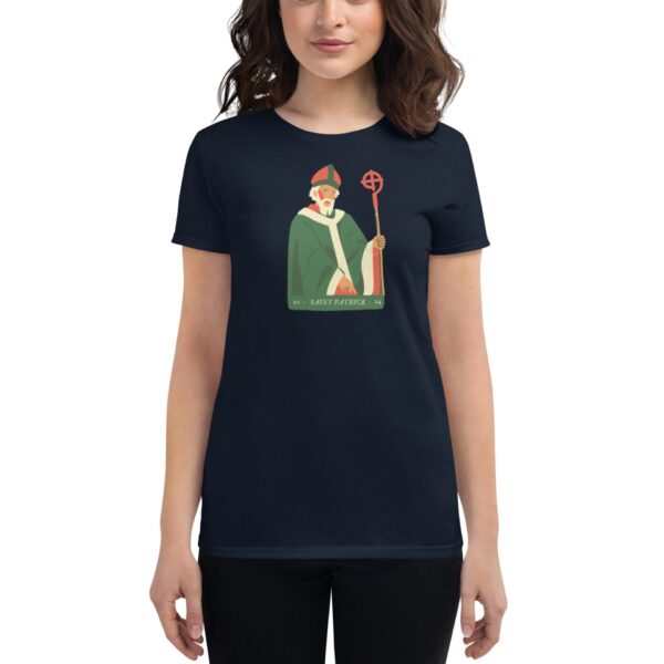 A person is wearing a navy shirt featuring an illustration of a bearded figure in green robes holding a staff the text reads SAINT PATRICK at the bottom with numbers 20 and 24