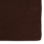 A brown fabric swatch lies flat showcasing a smooth texture and folded edge highlighting stitching details the surrounding context is a plain background suggesting minimalism