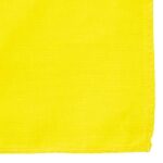 A bright yellow cloth is displayed flat with a neat stitched edge while showcasing a solid texture in a well-lit environment  creating a vibrant visual impact.