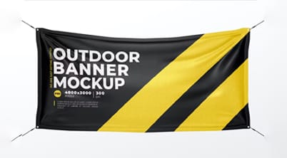A large rectangular banner displays bold text with a black and yellow diagonal stripe design promoting outdoor advertising. It is suspended horizontally  showcasing a mockup layout for display purposes.