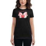 A black t-shirt features a colorful graphic of two gnomes holding a heart with the word "LOVE" surrounded by text that reads "A love like gnome other" in a playful font.