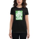 A person wearing a black t-shirt stands holding their hands slightly to the side. The shirt features a vibrant green graphic with the text "DO WHAT MAKES YOU HAPPY" and "HAPPY ST. PATRICK'S DAY" below.