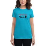 A woman wears a bright blue t-shirt featuring the text "Valentines Babe" in red and black with heart graphics  set against a plain white background.
