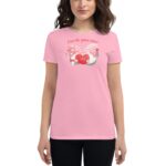 A woman wears a pink shirt featuring two cartoon gnomes holding a heart labeled Love with a playful message above them stating A love like gnome other