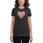 A woman wears a black t-shirt featuring a pink heart design with the word love in stylish lettering showcasing a casual and affectionate style.