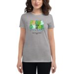 A woman is wearing a gray t-shirt featuring the text "FOCUS ON THE Good Things HAPPY ST. PATRICKS 2024" in colorful letters  suggesting a festive and positive theme.