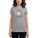 A woman is wearing a gray t-shirt featuring a smiling coffee cup graphic surrounded by hearts with the text "ALL YOU NEED IS LOVE AND A CUP OF COFFEE" above and below the graphic.