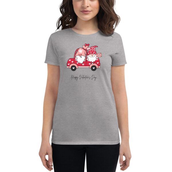 A gray t-shirt features a cartoon red car with two gnomes inside adorned with hearts celebrating love. The text "Happy Valentine's Day" is displayed below the illustration.
