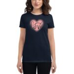 A woman is wearing a dark t-shirt featuring a large pink heart with the word love written in a stylish font at its center  standing against a plain background.