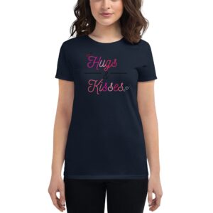 A person is wearing a black t-shirt with the text “Hugs & Kisses” displayed in pink and white letters  suggesting a casual  affectionate theme in a neutral setting.