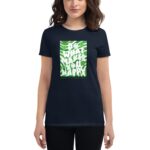 A person is wearing a dark t-shirt featuring a colorful graphic that reads DO WHAT MAKES YOU HAPPY along with the text HAPPY ST.PATRICK'S DAY amidst a festive background.