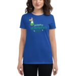 A blue t-shirt features a cartoon character in a green dress holding a basket alongside the text HAPPY ST. PATRICK'S DAY in green font with decorative elements  worn by a woman.