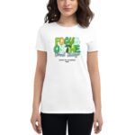 A woman wears a white t-shirt featuring colorful text that reads FOCUS ON THE Good Things with a message that says HAPPY ST. PATRICKS 2024  standing against a neutral background.