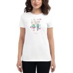 A woman is wearing a white t-shirt featuring a colorful illustration of a couple with hearts around them the text love you is written beneath the illustration