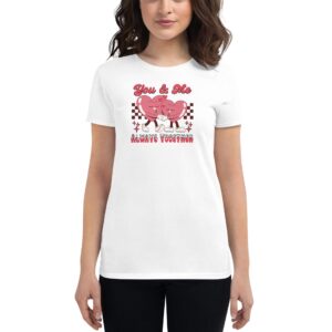 A woman is wearing a white t-shirt featuring two cartoon heart characters holding hands with text above them reading You & Me and below them stating ALWAYS TOGETHER in a playful design