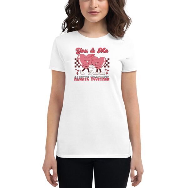 A woman is wearing a white t-shirt featuring two cartoon heart characters holding hands with text above them reading You & Me and below them stating ALWAYS TOGETHER in a playful design