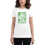 A woman wears a white t-shirt featuring green text that reads "DO WHAT MAKES YOU HAPPY" with a smiling face and shamrocks  celebrating St. Patrick's Day.