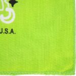 A bright green fabric with a smooth texture features a white artistic design and black text that reads U.S.A. The vibrant color creates a lively and engaging appearance.