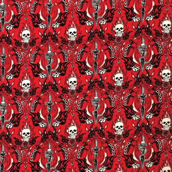 A close-up image of a collection of red skull and dagger pendants, imported from overseas.