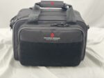 A black tactical bag with two zipped compartments features a soft velcro patch on the front and carries the logo of Advance Warrior Solutions against a light backdrop.