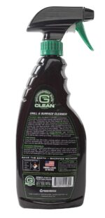 A spray bottle of cleaner labeled for grills and surfaces sits upright displaying instructions for use and environmental details in a black and green color scheme.