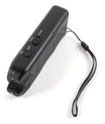 A handheld black device with buttons labeled ON Light Train and Chaser is resting on a white surface featuring a strap for easy carrying designed for training and controlling pets.