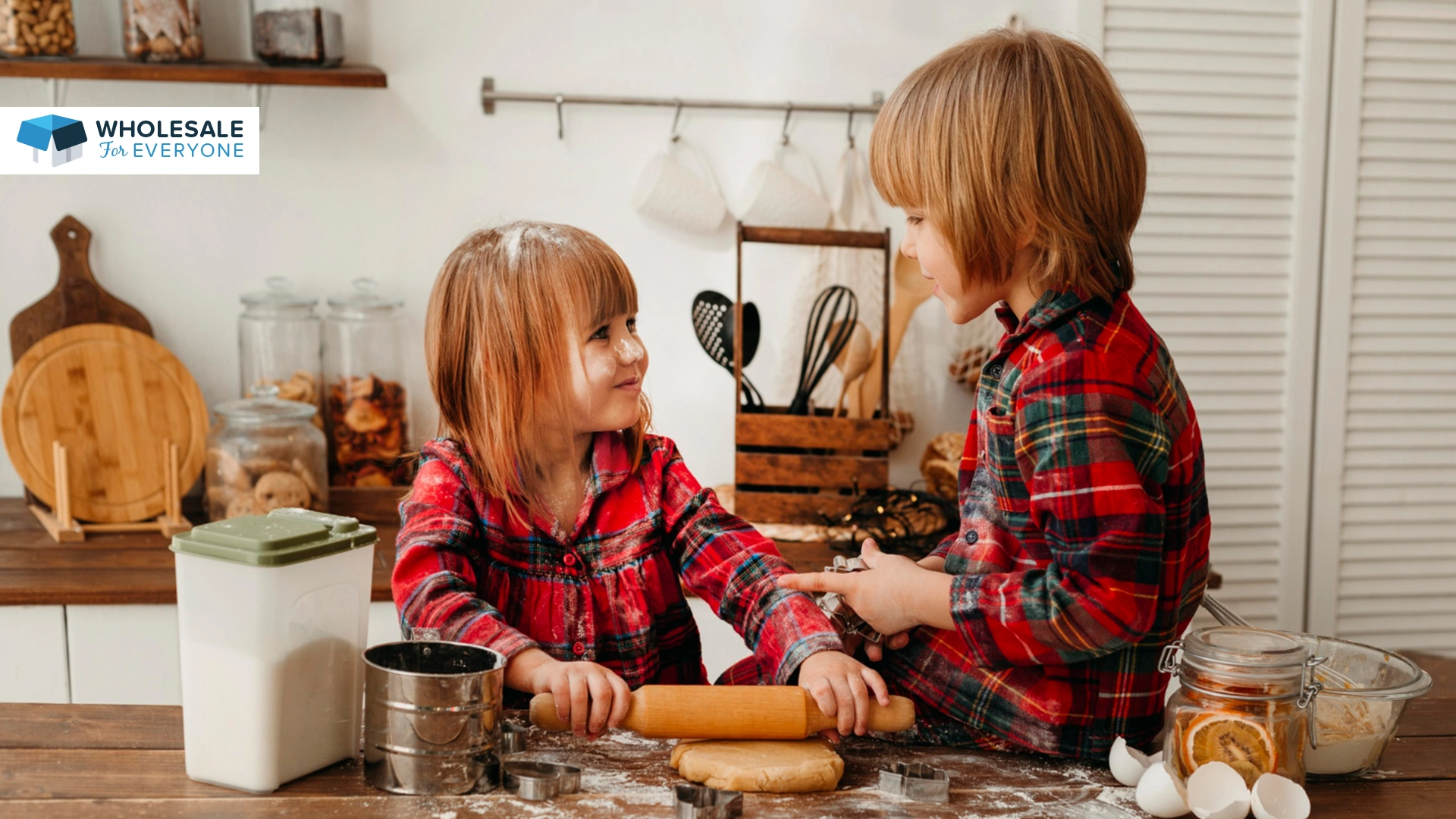 The photo shows to kids looking at each other in the kitchen.