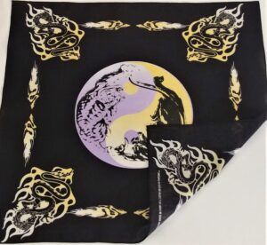 A black cloth features a central purple and yellow yin-yang design with intricate drawings of a tiger and a dragon surrounded by flame motifs in yellow and white.
