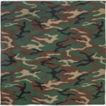 A patterned fabric features a camouflage design with green brown and black swirls and shapes creating a textured appearance ideal for military or outdoor contexts.