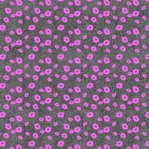 A textured fabric with a gray background features scattered pink dots. The dots are irregularly shaped  creating a playful pattern across the entire surface of the fabric.