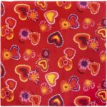 A red fabric features a pattern of multicolored hearts and circular shapes in various sizes displaying vibrant tones of yellow pink and purple against the bold red background.