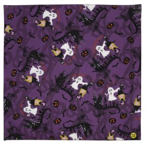 A purple fabric displays a repeated pattern of ghosts  cats  bats  pumpkins  and witches against a whimsical Halloween-themed backdrop  creating a festive atmosphere.
