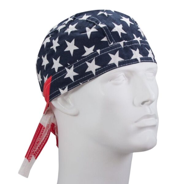 A fabric cap featuring a navy background with large white stars and red accents rests on a mannequin head in a neutral setting  suggesting a patriotic theme.