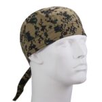 A camouflage-patterned bandana is displayed on a mannequin head with a straight expression showcasing its design and colors against a plain background suggesting use for outdoor activities or military purposes.