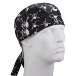 A black bandanna featuring white skull and crossbones designs is worn on the head of a mannequin depicting a neutral facial expression in a plain backdrop.