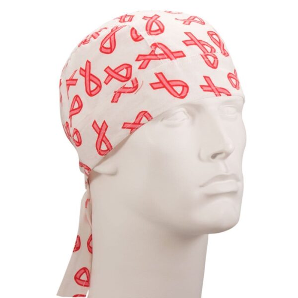 A white bandana with red ribbon patterns is displayed on a mannequin head showcasing its design and purpose as a head covering often associated with cancer awareness.
