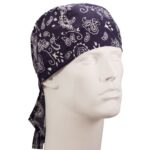 A black bandana with white paisley patterns is tied around the head of a white mannequin displaying a neutral expression in a simple  uncluttered setting.