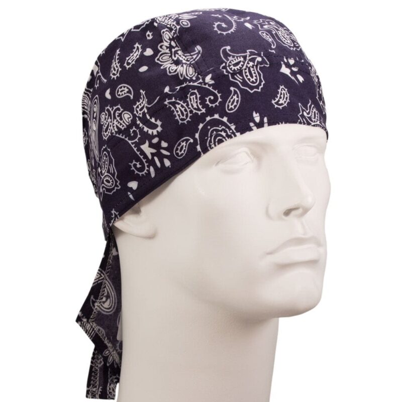 Paisley Head Wrap - 100% Cotton - Imported A black bandana with white paisley patterns is tied around the head of a white mannequin displaying a neutral expression in a simple uncluttered setting.
