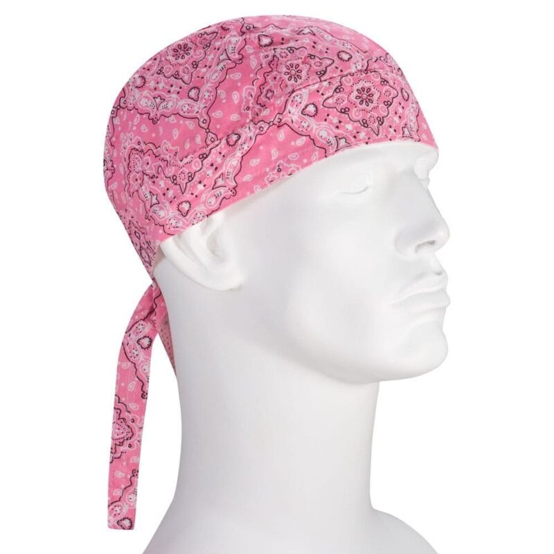 A pink bandana is tied around the head of a white mannequin figure the bandana features a paisley pattern with a long tail hanging down the side against a white background