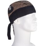 A bandana is displayed on a white mannequin head facing right. The bandana features a black spider web pattern with a skull design on the front  tied at the back.