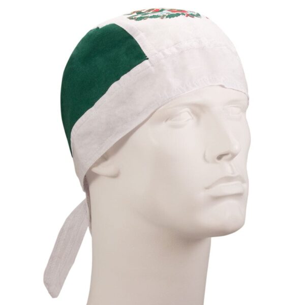 A white and green bandana is worn on a mannequin head showcasing its design. The bandana features colors and patterns that may represent cultural significance.