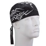 A black bandana with white tribal patterns wraps around the head of a mannequin facing forward in a neutral display setting focusing solely on the headwear.