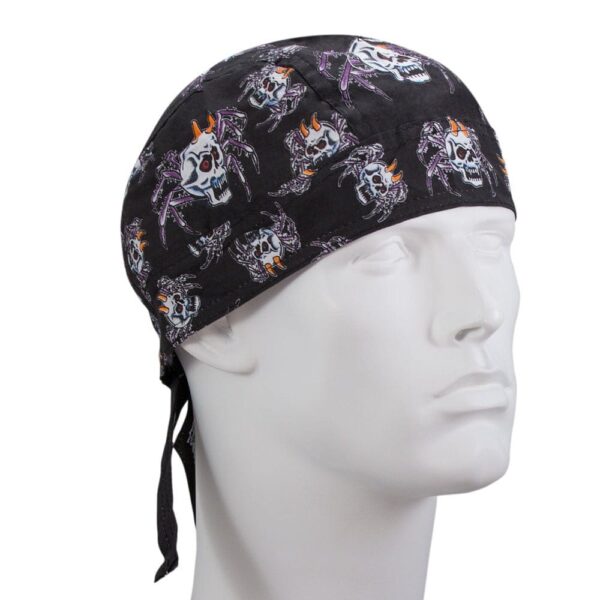 A black bandana featuring skulls and spider designs is displayed on a plain white mannequin head with ties hanging from the back in a neutral setting.