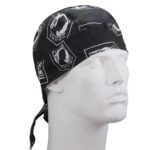 A black bandana with white patterns is worn on the head of a mannequin displaying a front-facing view in a neutral setting. The designs feature various symbols and text.